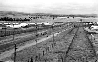 A general view of the space between the four compounds of the Cowra prisoner of war camp. “B” and “C” compounds are on the left while “A” and “D” compounds are on the right. Courtesy Australian War Memorial.