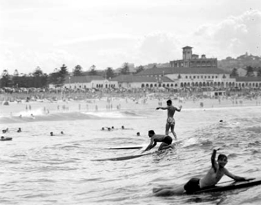 Surfers at Bondi displaying the old Australian style of surfing 1950 NAA