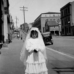 Gina Mascaro nee Marasco dressed for her first 'Holy Communion' outside her house at 106 Forbes Street, East Sydney, NSW 15 August 1954. Courtesy of the Mascaro family