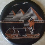 "The plate is about 12cm in diameter with embossed image of pyramids and sphinx. I brought it over from Egypt to remind me of my life there."