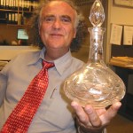 "This crystal decanter has always been used in our family for the Kiddush wine. It was bought the same time as the matzah cover."