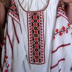 "I embroidered the orange and white blouse; it is traditional Ukrainian embroidery but done in colours that I like. The other blouse [is unique]; I never saw it anywhere except in my village."