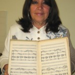 Angelita Gomez with her uncle's music book