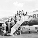 German migrants arrive onboard a T.A.A. Viscount flight, c.1956. These migrants flew from Hamburg, Germany, under the assisted passage scheme sponsored by the Inter-governmental Committee for European Migration. Courtesy National Archives of Australia.