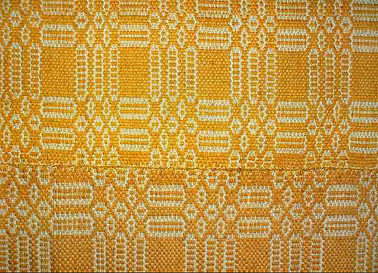 Blanket woven from shredded broom plant. Made by Maria Musolino in Careri Reggio Calabria c1920s, brought out to Australia in 1933. Display at Griffith Italian Museum, 2008. Photograph Peter Kabaila