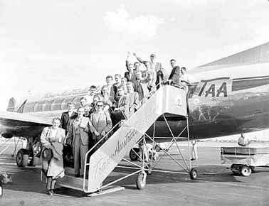 German migrants arrive onboard a T.A.A. Viscount flight. C.1956. These migrants flew from Hamburg, Germany, under the assisted passage scheme sponsored by the Inter-governmental Committee for European Migration. Courtesy National Archives of Australia