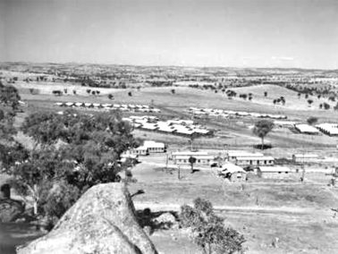 Looking west showing compounds of the Cowra prisoner of war camp with the group headquarters buildings in the foreground. Courtesy Australian War Memorial