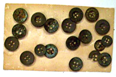 Buttons recovered from the drains from guards' and internees' clothing, c.1915-18