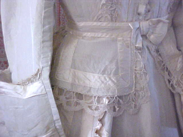 Detail of the Pabst wedding gown, showing hand crocheted lace trim.