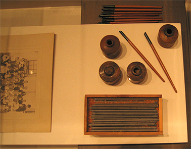 From left: Soy sauce jar, chopsticks, Book (New Testament) meat clever, wide mouth jar, wrist protectors, c1850-80s. Wong Collection. Photograph Stephen Thompson