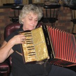 "In the Baltics people like the Piakordia, a small piano accordion. I think my father wanted us to play - I saw him hold it but never saw him play. I'm the only one who plays and I'll keep it for our grandchildren."   "I'll play you a German folk song - Du Du Liebst In Herzen - it's very popular."