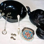 Henny: "The Basaltware teapot, jug and bowl were heirlooms from my great-grandmother. It was always in grandmother's china cabinet. The silver spoons were used for cream and sugar. The cufflinks were made of Dutch coins in defiance of the Germans because they had Queen Wilhelmena's head on them."