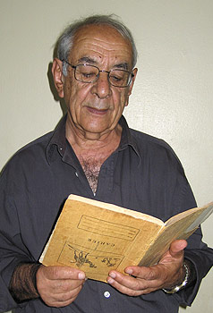 Chafic Ataya with his exercise book with poems