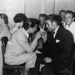 Young Italian men enjoying a cigarette and a chat at the Italo-Australian Club in George Street, Sydney, NSW 1954. Courtesy of the Urbani family