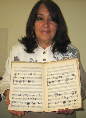 Angelita Gomez with her uncle's music book