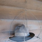 Harry Zac, a German opal miner, lived on pumpkin and wild pig at the Grawin field for 50 years until his death in 1976. His bark hut still stands with examples of his bush ingenuity – hat rack and table are on display at the LRHS. Photograph Lightning Ridge Historical Society