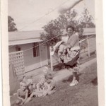 My mom and some of the children in front of our apartments