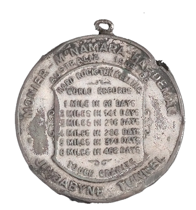 The medal marks a series of tunnelling records, but this achievement came at a cost. Blasting through hard rock to create tunnels was dangerous work, accounting for 35 of the 121 lives lost on the scheme. Powerhouse Museum Collection.