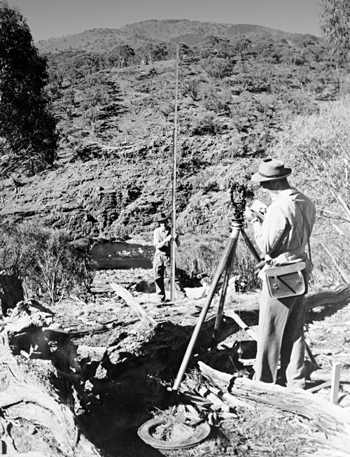 Surveyors using a Theodolite tool, c.1949. Courtesy National Archives of Australia