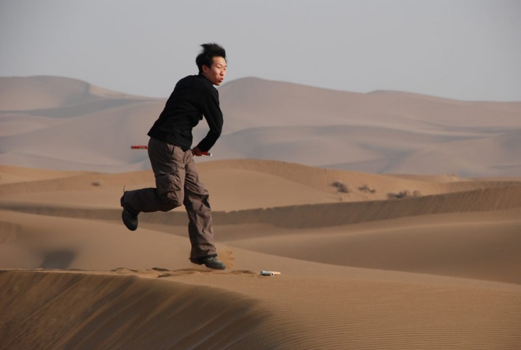 Jake using Nunchucks in Dessert Park, Hami City, Xinjiang Province, China, February 2008